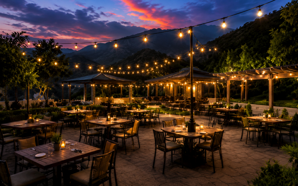 Outdoor restaurant with mountain views and evening dining atmosphere in Kallar Kahar, Punjab, Pakistan.